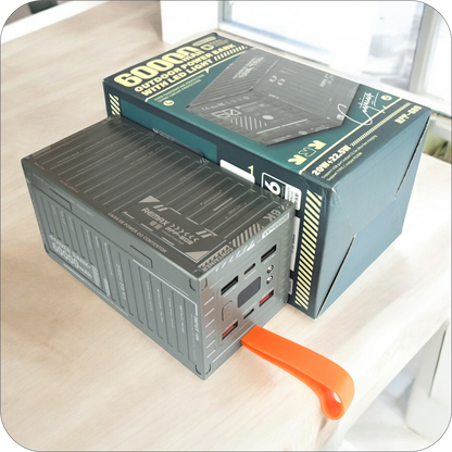 bateria portatil remax de 60000mah junto a su empaque