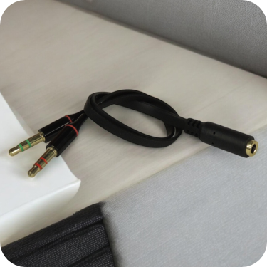 cable de audio enrollado con conector de 3.5mm y dos conectores de 1.4mm 
